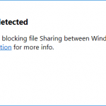 Screenshot of the Docker for Windows error popup window with the message "Firewall detected - A firewall is blocking file Sharing between Windows and the containers. See documentation (a link) for more info.